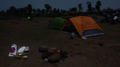 Group of people relaxing on field