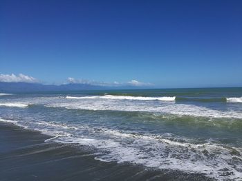 Scenic view of sea against blue sky