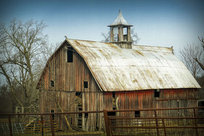 House by building against sky