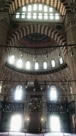 Low angle view of illuminated chandelier in building