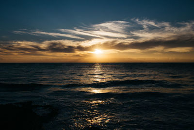 Scenic view of sea against sky during sunset