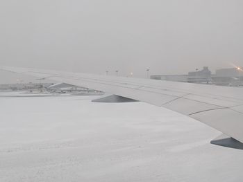 Scenic view of snow covered landscape against sky