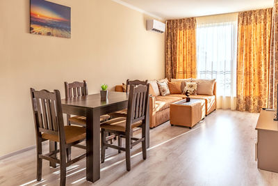 Empty chairs and tables in room