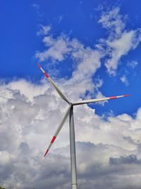 Low angle view of wind turbine against sky