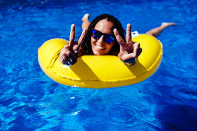 Portrait of smiling boy in swimming pool