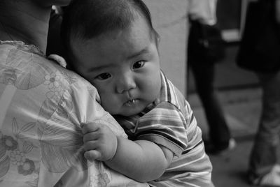 Close-up of mother holding baby boy