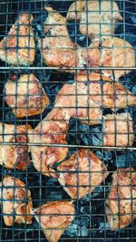 Full frame shot of meat on barbecue grill