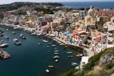 Tilt-shift image of sea by buildings