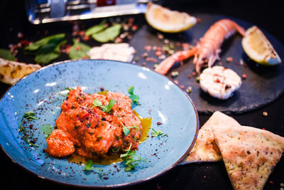 High angle view of meat in plate on table