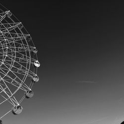 Low angle view of ferris wheel against sky at night