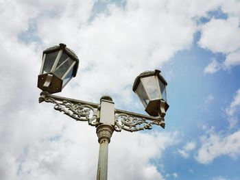 Low angle view of street light against sky