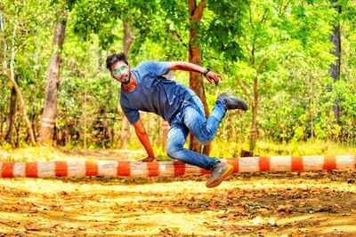 Man jumping in forest