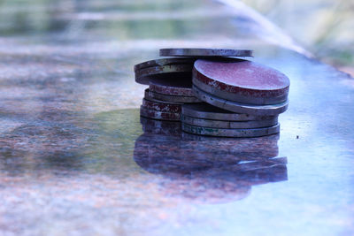 Close-up of metallic coins on table