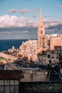 View of buildings in city against sky