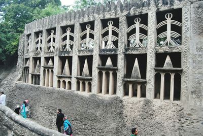 People at historic building in rock garden of chandigarh