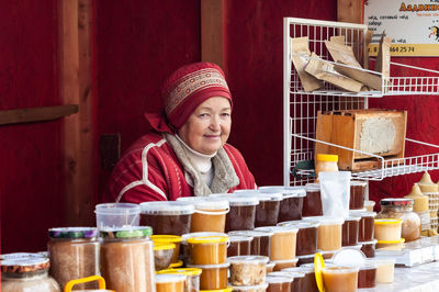 Portrait of smiling woman in market