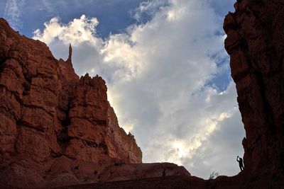 Low angle view of rock formation against sky