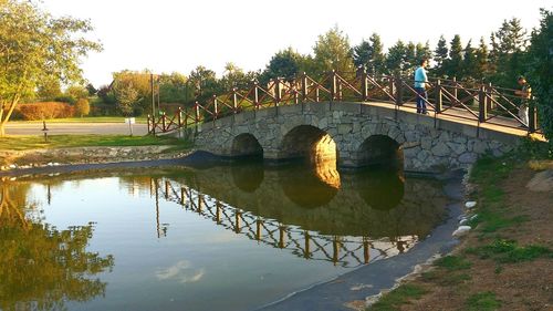 Bridge over river against sky