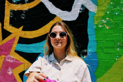 Portrait of young woman in sunglasses