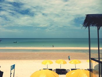 Scenic view of sea against cloudy sky