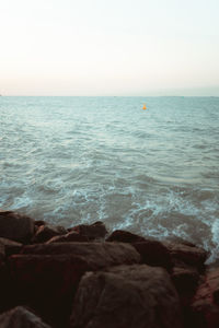 Scenic view of sea against clear sky