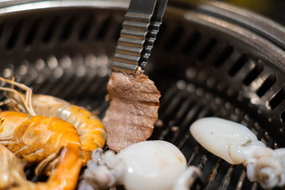 Close-up of meat on barbecue grill