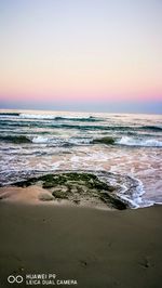 Scenic view of sea against clear sky during sunset