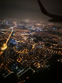 Aerial view of illuminated cityscape at night