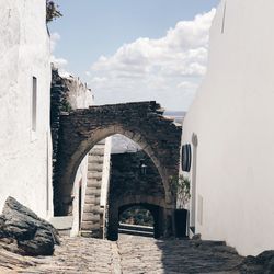 Arch and steps against sky