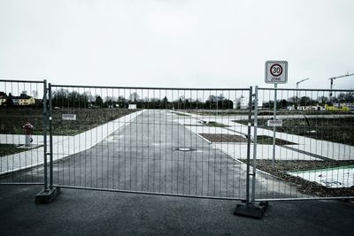 Barricade on road against clear sky