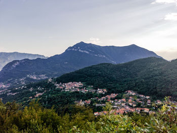 High angle view of trees and mountains against sky