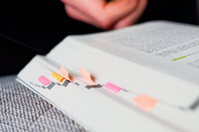 Close-up of hand holding paper