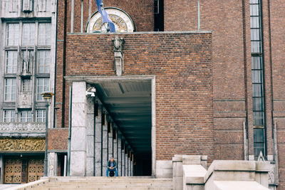 Man walking on staircase of building