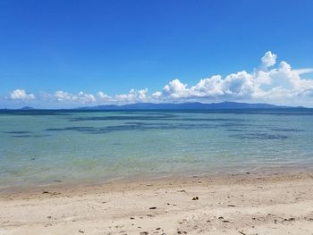 Scenic view of sea against blue sky