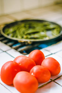 Close-up of tomatoes in bowl on table at home