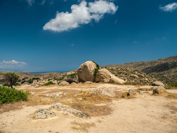 Scenic view of arid landscape against sky