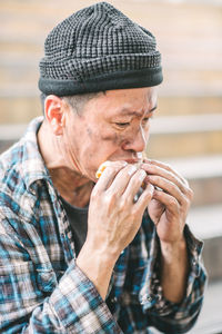 Beggar eating food outdoors