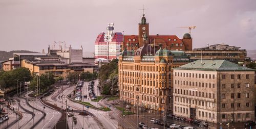 High angle view of buildings in city against sky