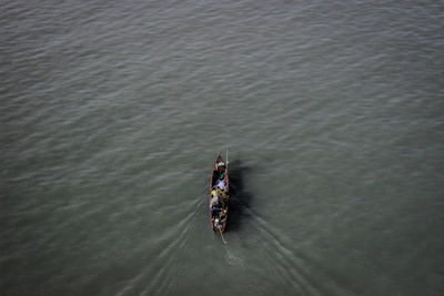 High angle view of people on boat sailing in river