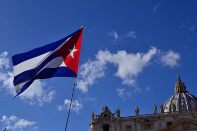Cuban flag with church in background