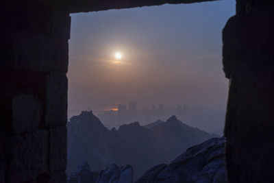 Silhouette of city at sunset