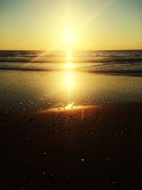 Scenic view of sea against sky at sunset