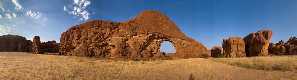 Panoramic view of rock formations on landscape against sky