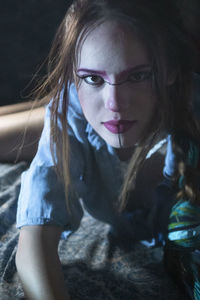 Portrait of young woman at home