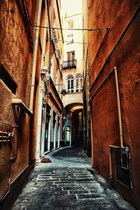 Alley amidst buildings in city