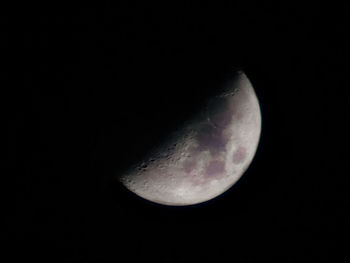 Low angle view of moon against sky at night