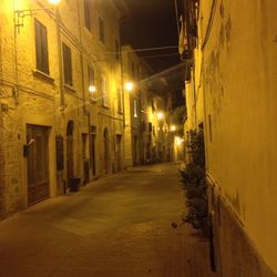Empty illuminated street at night