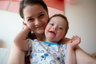 Portrait of happy mother and baby