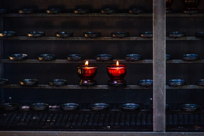 Still life of lit tea light candle