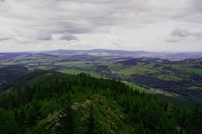 Scenic view of mountains against cloudy sky